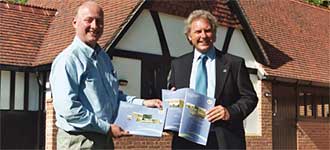 Richard Clarke, Director of the AONB (left) and Martin Spray, Chairman of the North Wessex Downs AONB Council of Partners (right) review the Management Plan.