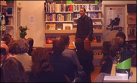 Will Self reading to a packed-out Oxfam in Reading