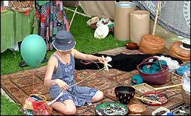woman on floor working with threads and buttons