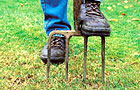 Aerating lawn with fork