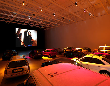 Phil Collins, Auto-Kino!, 2010. A stationary drive-in cinema with a curated programme of films and videos. Co-organised with Siniša Mitrović. Installation view, Temporäre Kunsthalle, Berlin - courtesy of Shady Lane Productions
