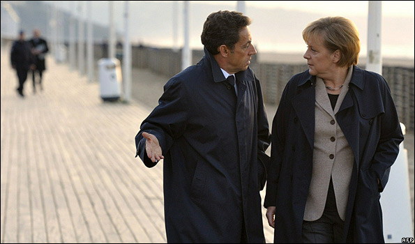 French President Nicolas Sarkozy and German Chancellor Angela Merkel on Deauville boardwalk, 18 Oct 10