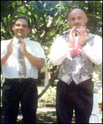 Two men at a wedding