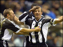 Shearer celebrates against Everton