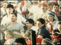 Fans shouting and waving