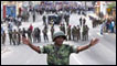 Madagascar soldier holds back protesters in February 2009