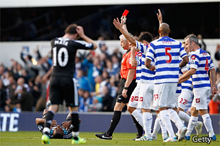 Referee Chris Foy sends off Didier Drogba of Chelsea after a foul on Adel Taarabt