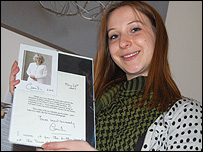 Lora holds a letter from Camilla