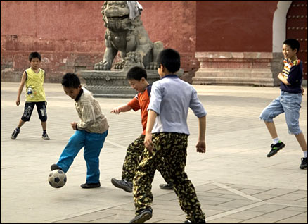 CHILDREN PLAYING FOOTBALL IN DONGCHENG