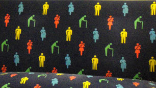 Priority seats on the Tokyo underground, with symbols of disabled people in the upholstery pattern