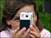 Girl taking photograph