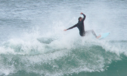 Surf coach Carl Russell leads the way up at Portrush recently. Pic: Ger.