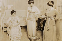 Lucile dresses a mannequin