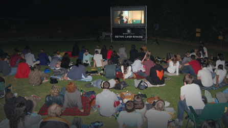 Photograph of an audience watching a screening of Big Font. Large Spacing