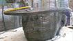 Photograph of the head of the Six Bells Miners' Memorial sculpture under construction in Sebastien Boyesen's studio