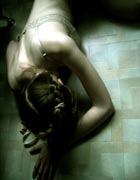 A girl slumped on the floor in obvious distress. Image credit: iStockphoto/Julia Keller