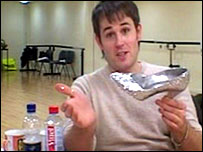 Trevor Jary holds Cinderella's glass slipper