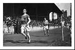 Eric Liddell breaks the tape