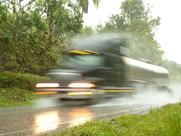 Speeding truck on the wet highway in Panama