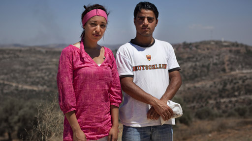 Reya El Salahi meets a young Arab villager, Muntassar Khalid Alkadi, in the village of Awarta, close to the Jewish settlement of Itamar in the West Bank.