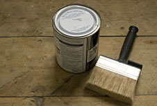 paint brush and tin of paint