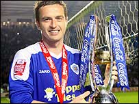 Leicester City's Matt Oakley holding the League One Trophy, presented to the team on Friday 24 April 2009 during the Scunthorpe game.