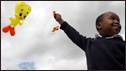 A south African child flies a kite