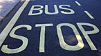 Bus stop sign on the road