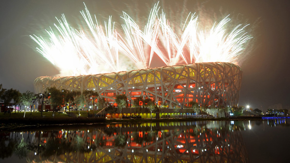 Fireworks exploding outside Beijing's National 'Bird Nest' Stadium during the opening ceremony for the 2008 Olympics.