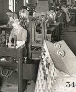 Workers cracking off and grinding glass