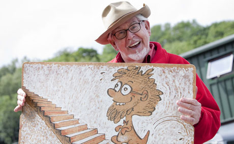 Rolf Harris with his wobble board during filming of Rolf on Welsh Art