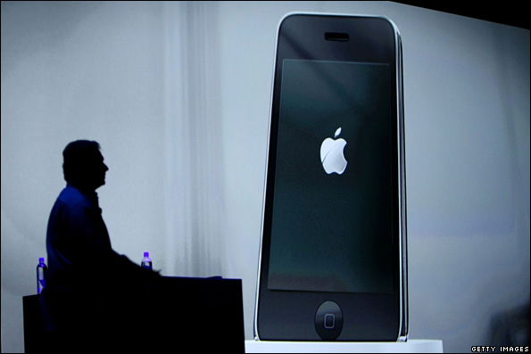 Phil Schiller watches a video at the Apple World Wide Developers Conference