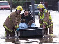 Carried to safety from the flood-waters