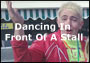 Dancing In Front Of A Stall
