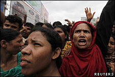 Garment workers shout slogans during a protest in Dhaka