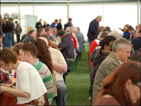 Crowds of people drinking beer