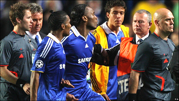 Didier Drogba argues with the referee 
