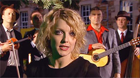 Lauren Laverne with band in background