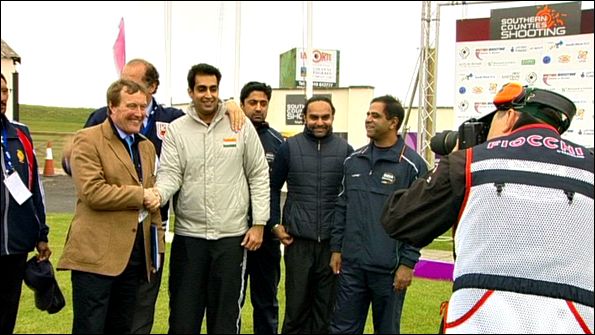 Organisers and Indian team members shake hands