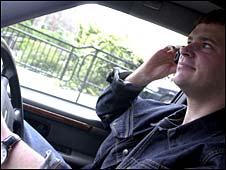 Man using mobile phone while driving