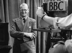 Arthur in front of a TV camera