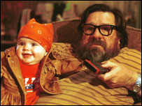 Is he a 'dedicated' or a 'devoted' grandfather?