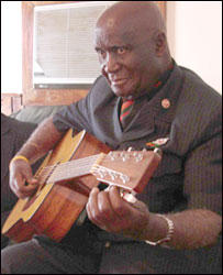 Kenneth Kaunda plays guitar