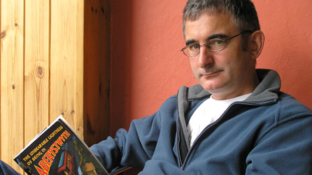 Malcolm Pryce pictured reading his novel The Unbearable Lightness Of Being In Aberystwyth