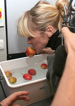 Edith bobbing for apples