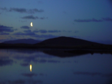 moon setting over Benbecula and South Uist