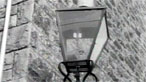 A wall mounted gas lamp
