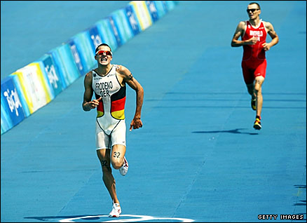 Germany's Jan Frodeno (left) outsprints Canada's Simon Whitfield to win triathlon gold
