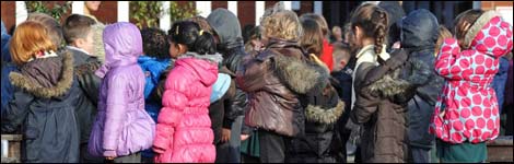 Children wait in a line at a primary school in England