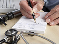 Doctor writing prescriptions